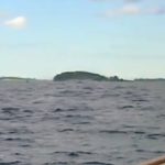 The Bow of Schooner Adirondack III sailing into Boston Harbor with another small sailboat in front of it for a Boston Harbor Cruise