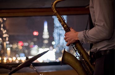 Close up of Saxaphone player playing music on a Boston Music Cruise