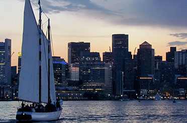 Schooner Adirondack III Sailing at Twilight with the Boston Skyline in the background