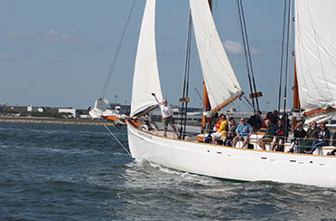 Schooner Adirondack III Sailing in Boston Harbor and the Crew and Guests are enjoying a day sail.