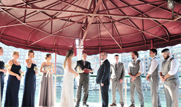 Wedding Ceremony on the top deck of yacht Northern Lights in Boston Harbor