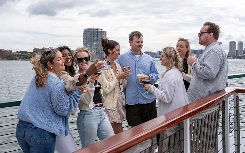 Guests on the bow of yacht Northern Lights taking a selfie on a sightseeing cruise