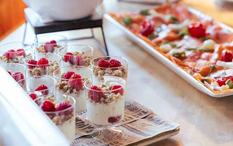closeup of assortment of hor d'oeuvres and yogurt on a table
