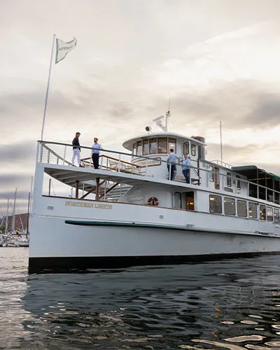 the motor yacht Northern Lights sitting on the water, outside of the Boston harbor