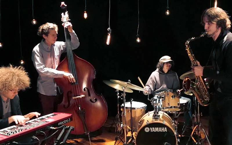 a band playing various instruments aboard a motor yacht