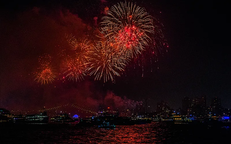 Fireworks over the water in Boston Harbor