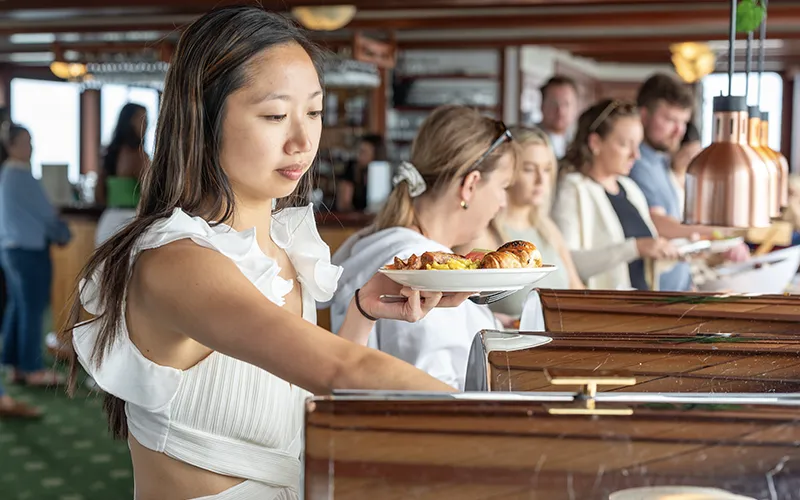 Guests enjoying a brunch on the yacht Northern Lights in Boston Harbor with Classic Harbor Line Boston