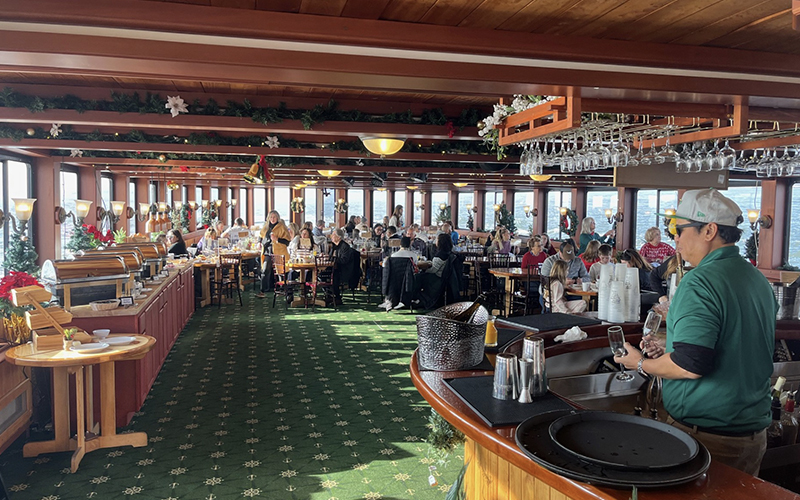 BostonHolidayBrunch3 Guests in the grand salon of yacht Northern Lights on a Holiday Brunch Cruise with Classic Harbor Line