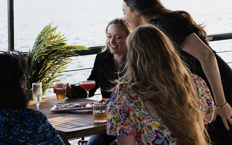 Guests on the upper deck of yacht Northern Lights for a Boston Brunch Cruise