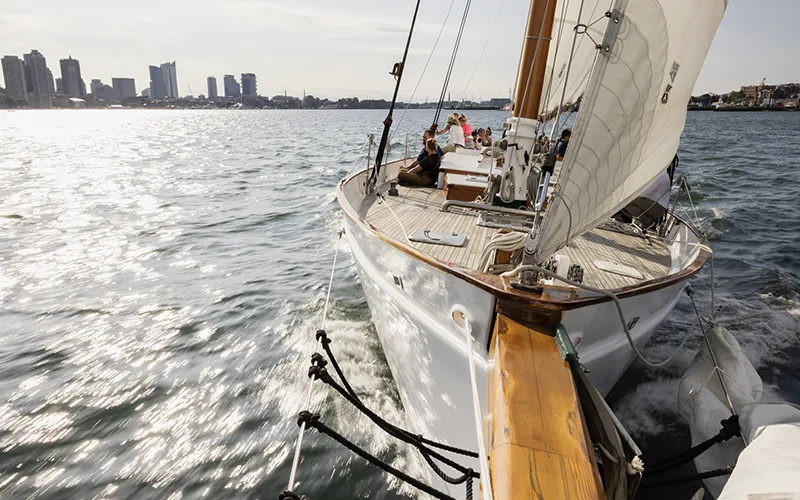 Schooner Adirondacks sailing in Boston Harbor with the Boston Skyline in the background
