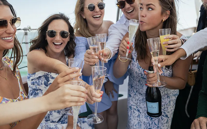 Group of women enjoying Champagne on a Day Sail in Boston Harbor aboard Schooner Adirondack III