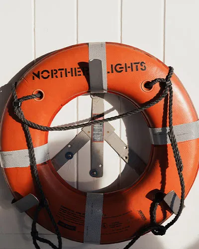 the words "Northern Lights" written on a life raft