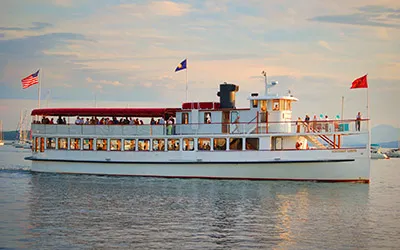 the yacht Northern Lights cruising down the river during a sunset cruise
