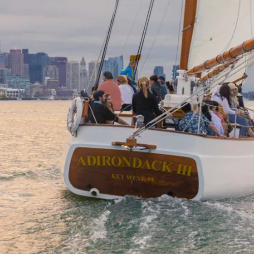 a rear view of the Schooner Adirondack III sailboat cruising down the river, located in Key West