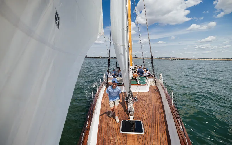 Guests onboard the Schooner Adirondack sailing in Boston Harbor