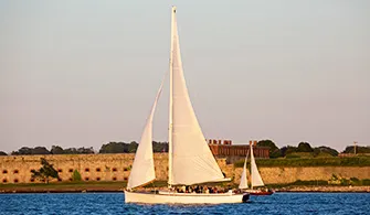 the Sloop Eleanor sailboat cruising down the river