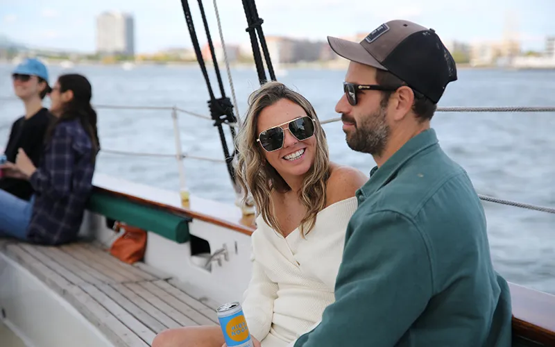 a couple enjoying a sail on Schooner Adirondack II in the afternoon.