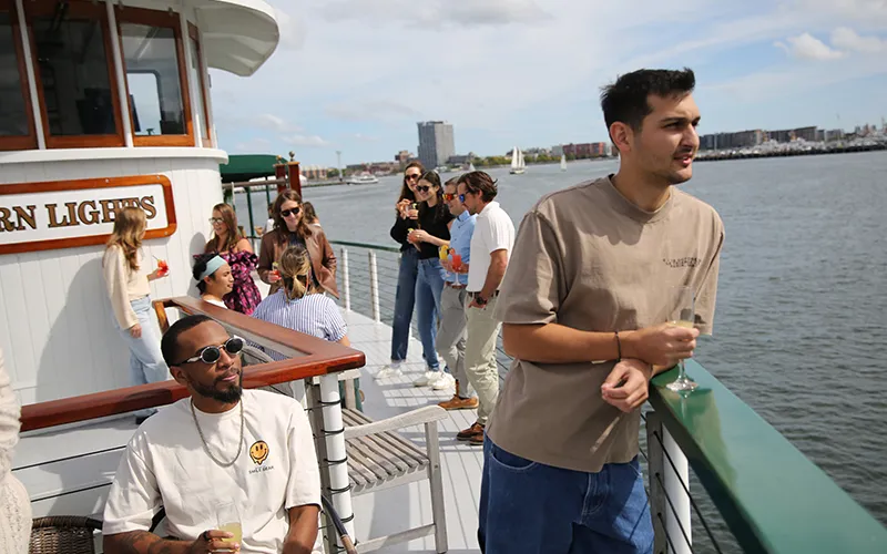 Group of friends enjoying an afternoon sightseeing cruise in Boston Harbor aboard the Yacht Northern Lights