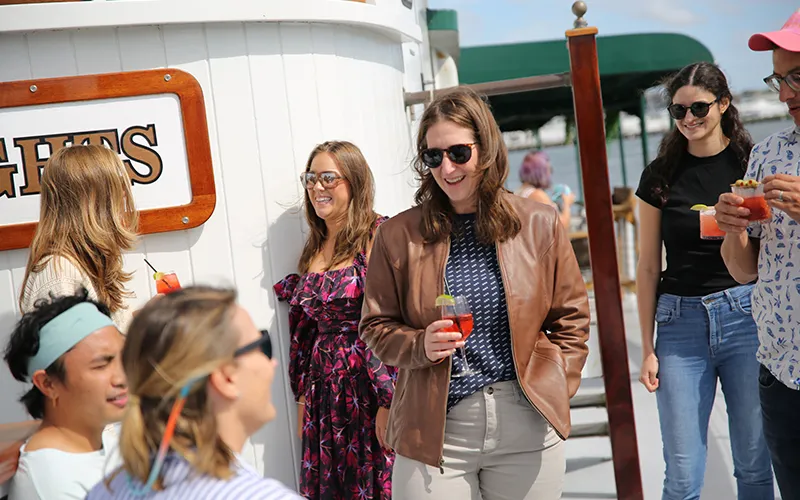 Group of friends enjoying an afternoon sightseeing cruise in Boston Harbor aboard the Yacht Northern Lights