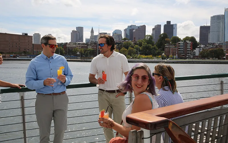 Group of friends enjoying an afternoon sightseeing cruise in Boston Harbor aboard the Yacht Northern Lights