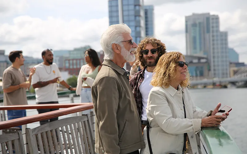 Family enjoying a sightseeing boat ride in Boston Harbor aboard the Yacht Northern Lights