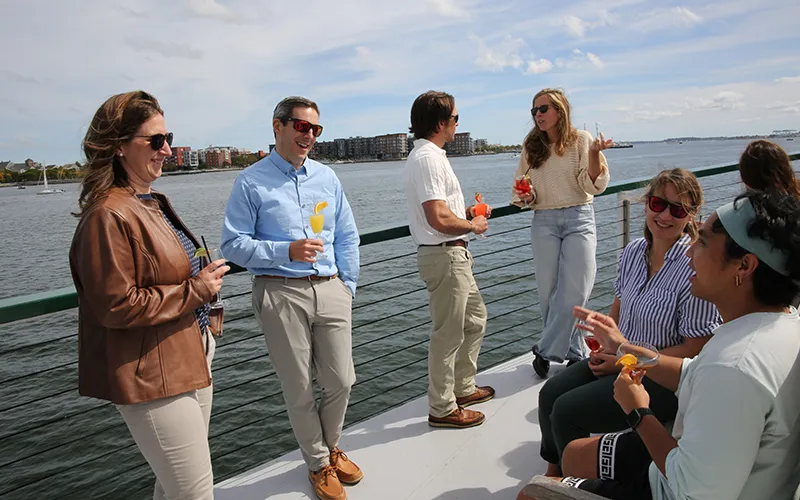 Group of Friends enjoying conversation on a sightseeing boat tour on the yacht Northern Lights in Boston Harbor