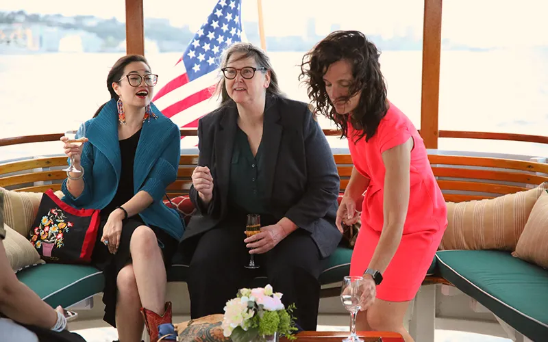 Patriotlifestyle35 Three women enjoying Champagne in the salon of the yacht Patriot in Boston Harbor