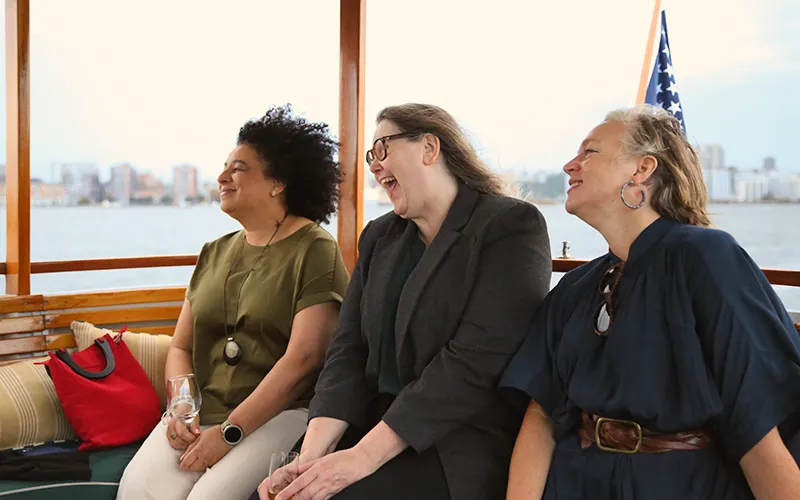 Friends enjoying a sightseeing cruise in Boston Harbor on the yacht Patriot